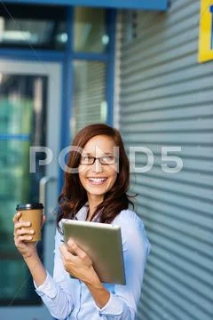 Woman enjoying a coffee break outdoors Stock Photos