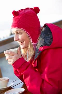Woman Enjoying Hot Drink In Caf̩ At Ski Resort Stock Photos