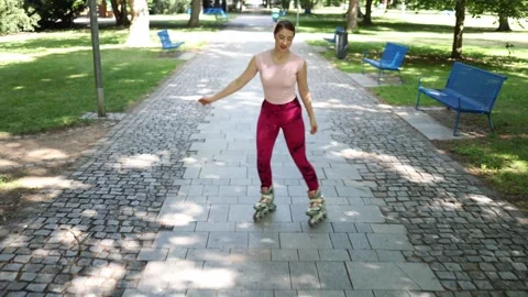 Woman enjoying inline skating workout in park Stock Footage 341477191