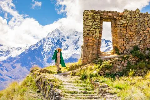 Woman enjoying the view high in the Andes Mountains while exploring Inti Punku Stock Photos