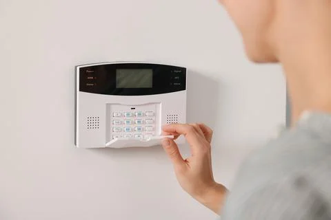 Woman entering code on security system, closeup Stock Photos