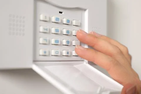 Woman entering code on security system, closeup Stock Photos