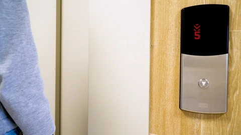 A woman enters the Elevator Stock Footage 128126324