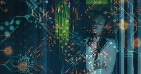 Woman examining server rack in data center, with circuit overlay and indicator Stock Photos