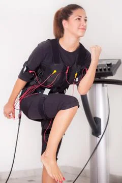 Woman exercise on  electro stimulation machine Foto stock