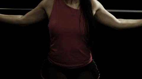 A woman exercises using a bungee cord Stock Footage 33831434