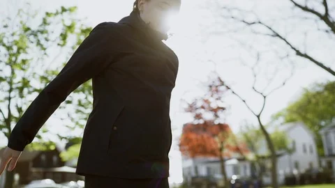 Woman exercising, doing jumping exercise on sunny playground. Slow Motion Stock Footage 109735683