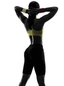 Woman exercising fitness arms behind head silhouette rear view Stock Photos