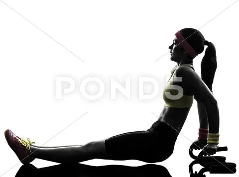 Woman exercising fitness push ups with holders silhouette Stock Photos