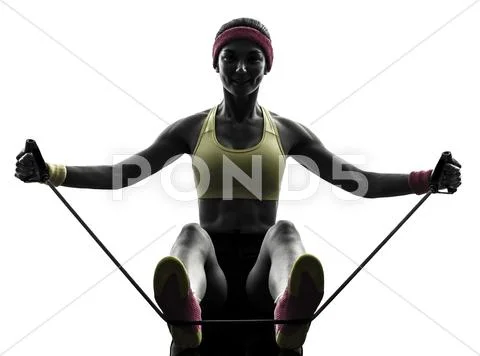 Woman exercising fitness workout resistance bands silhouette Stock Photos