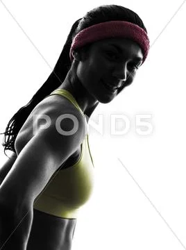 Woman exercising fitness workout silhouette smiling portrait Stock Photos