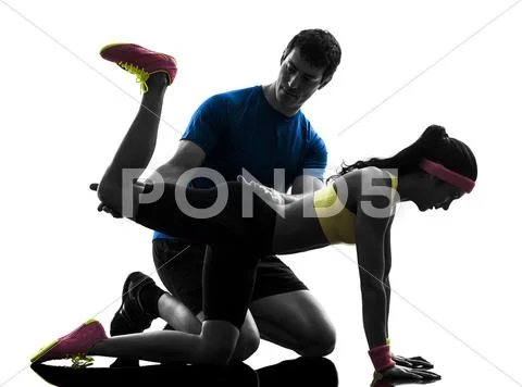 Woman exercising plank position fitness workout with man coach Stock Photos