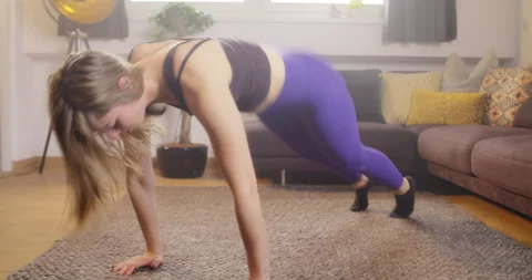 Woman exhausting workout session, Jumping exercises at home. Video stock 170976693