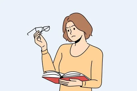 Woman experiences vision problems reading book and looks at glasses with u... Stock Photos