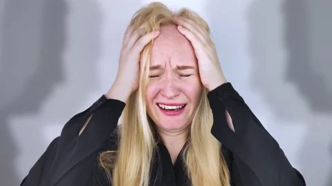 The woman is experiencing a panic attack. The concept of phobia, fears, paranoia Video stock 160885804