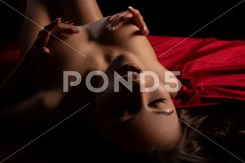 Woman experiencing a pleasurable moment at home Stock Photos