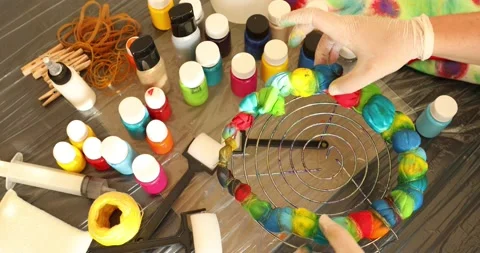 Woman explaing to camera how to tie dye 2 Stock Footage 131680824
