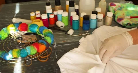 Woman explaing to camera how to tie dye 8 Stock Footage 131731244