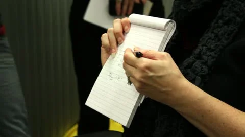 Woman explaining with a notebook Stock Footage 19927306