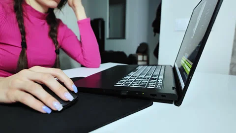 Woman Explaining Video Editing Process - Gesturing at Laptop Screen in Studio Stock Footage 306674822