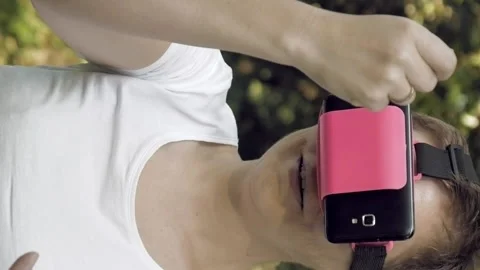 Woman explores virtual reality using VR glasses Video stock 91142577