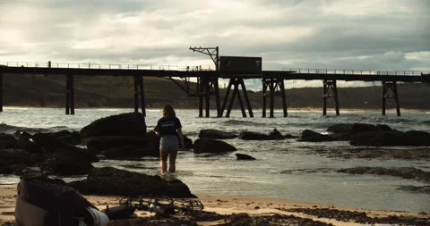 Woman Exploring Beach Video stock 155220971