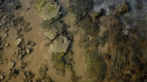 Woman exploring rock pools in Mooloolaba Australia Stock Footage 110887031