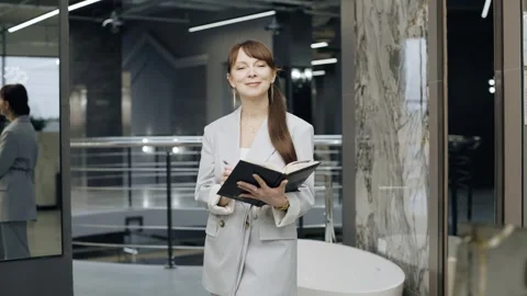 Woman exploring tile, examines a catalog while absorbing designs and textures Video stock 281076847