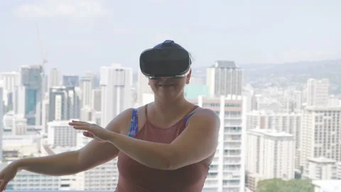 Woman exploring virtual reality dancing hula in slow motion 120fps Stock Footage 99853189