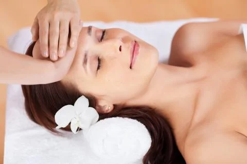 Woman in facial massage Stock Photos