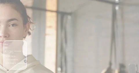 Woman facing camera viewing translucent UI panels fading demonstrating HTML CSS Stock Footage 318173976