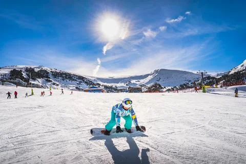 Woman, falling down when learning how to ride on a snowboard Andorra Stock Photos