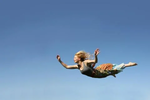 Woman Falling Through the Sky Stock Photos
