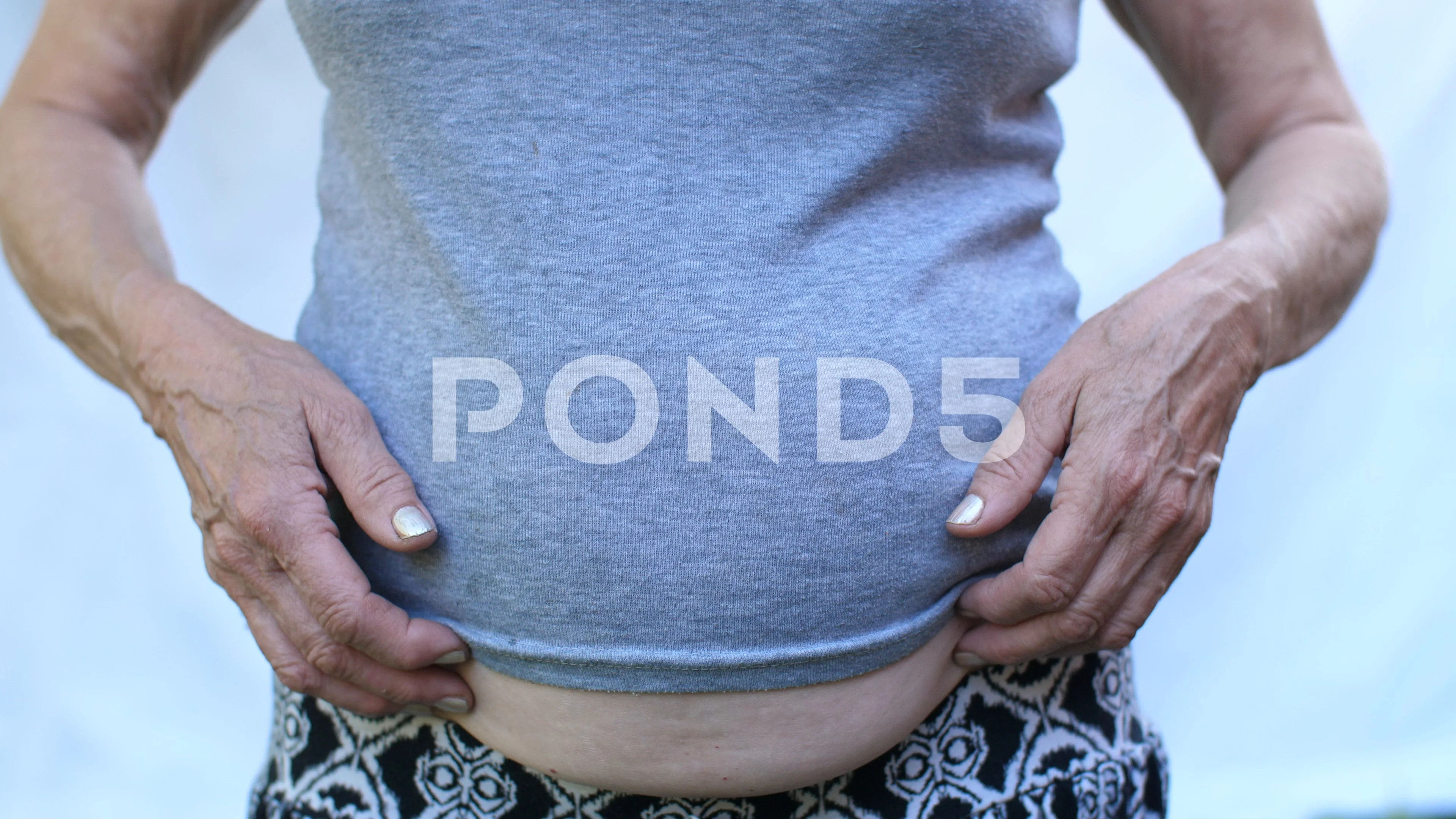 Woman with fat belly on white background