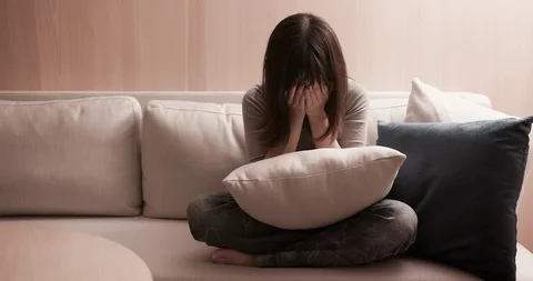 Woman feel depressed on sofa Stock Footage 105093553