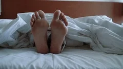 Closeup of the Soles of Female Feet with Socks Lying in a Bed Stock Image -  Image of elegance, caucasian: 260519105