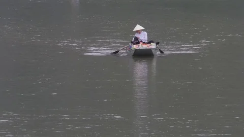 Woman feet peddling shop boat,Ninh Binh,Vietnam Stock Footage