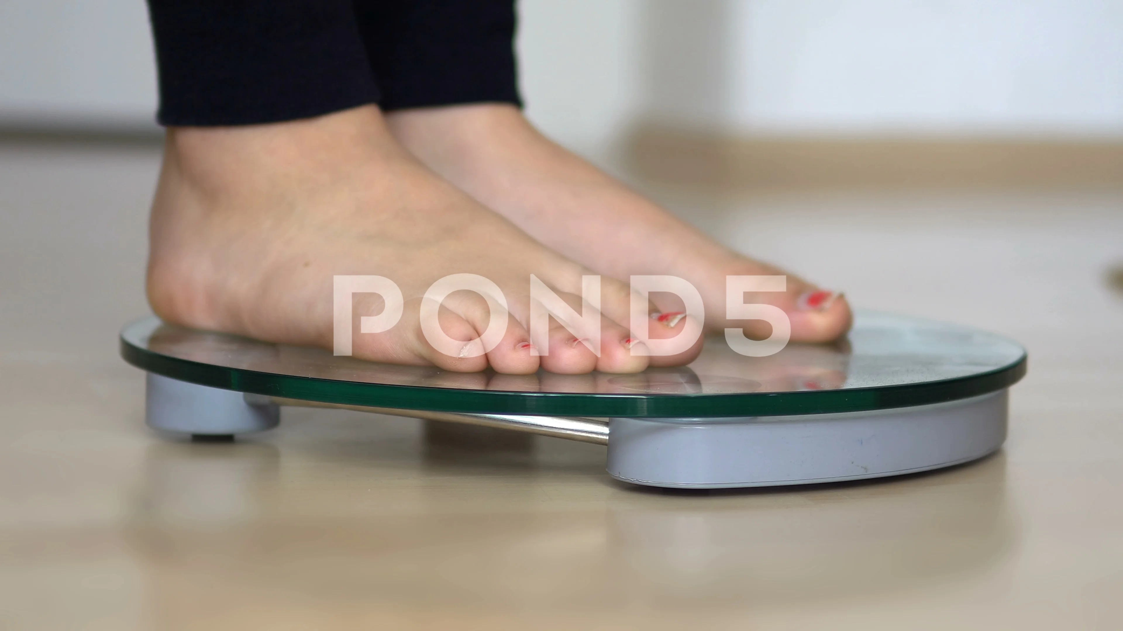 Women stand on electronic scales with measuring cables requiring weight  control. Woman foot stepping on weigh scales with tape measure. Diet  Concept 17154858 Stock Photo at Vecteezy
