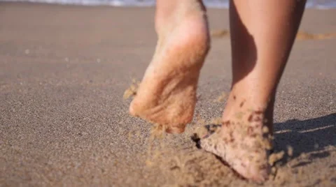 Woman Feet Walking on Beach Leaving Footprints in Sand Stock Footage