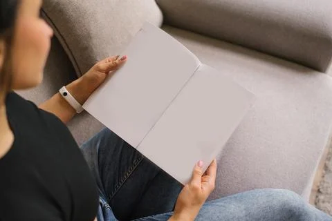 Woman (female) two hands hold an empty blank book spread Stock Photos