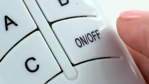 Woman finger holding and using wireless electrical remote controller Stock Footage 225856416