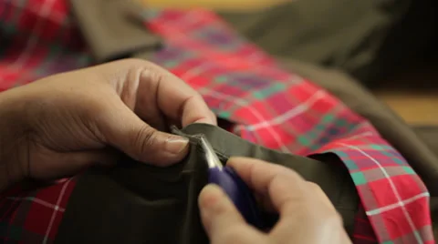 Woman fixing a texture with scissors Stock Footage 31450703