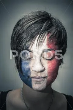 Woman with flag of france on face and closed eyes Stock Photos