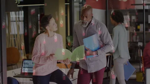 Woman flipping folder launching binary data streams and man pointing at laptop Stock Footage 314455556