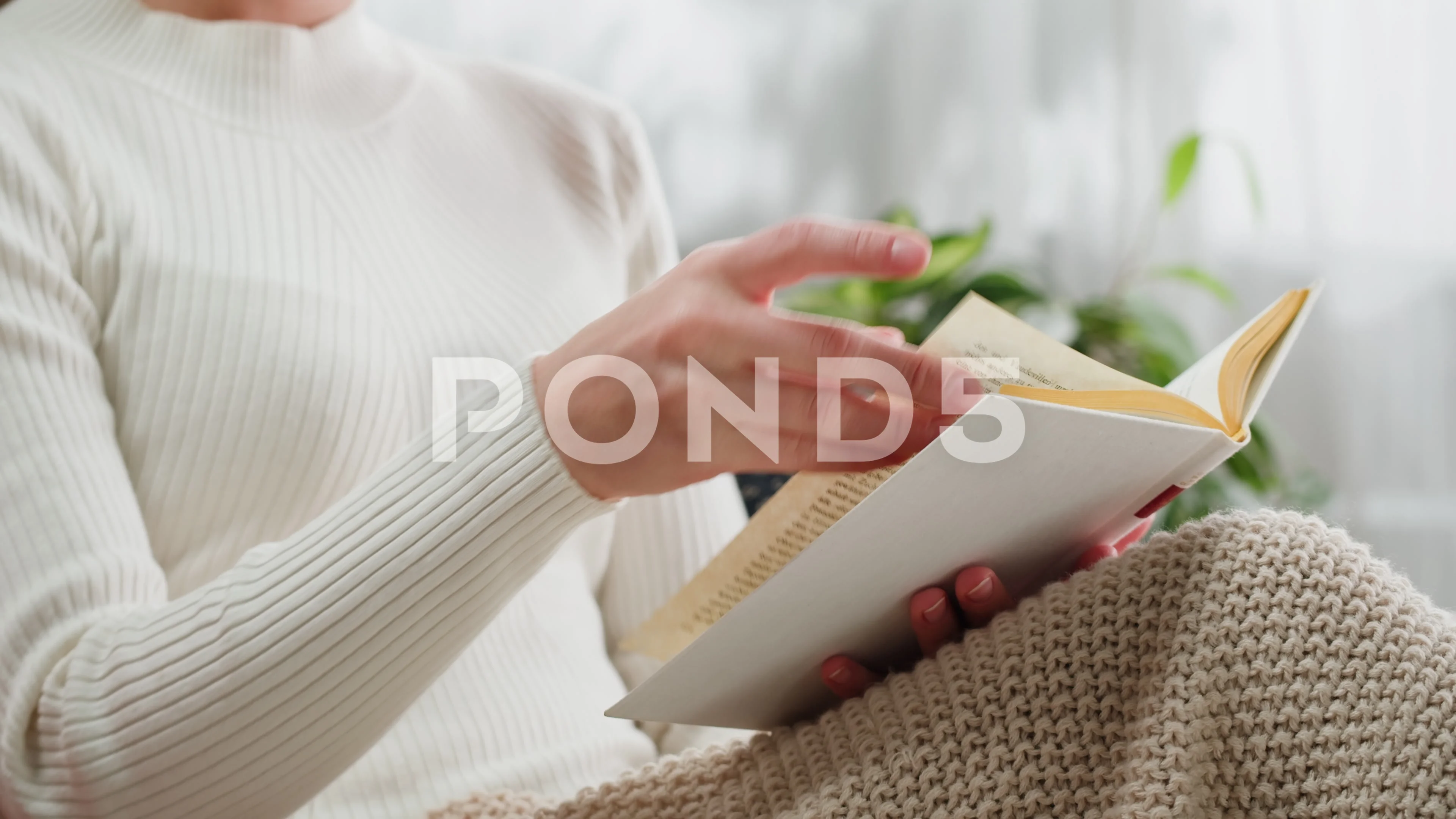 Woman Flipping german language book page... | Stock Video | Pond5