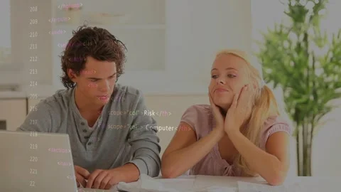 Woman flipping pages while debugging, man typing laptop, code overlaying screen, Stock Footage 328234020