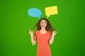 The woman flirt near a dialog signs on the green background Photo