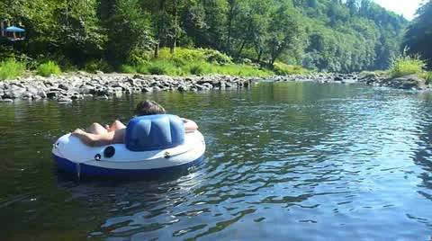 Woman Floating Down River Stock Footage 10888441