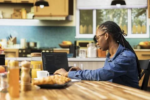 Woman focused on programming and software development tasks 스톡 사진