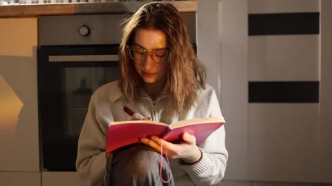 Woman focused on studying Video stock 334052277
